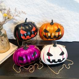 A unisex pumpkin skull ghost face bag with a metal chain design for Halloween